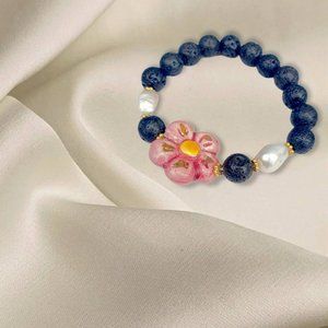 Bracelet with Caltagirone ceramic flower and lava stone and river pearl